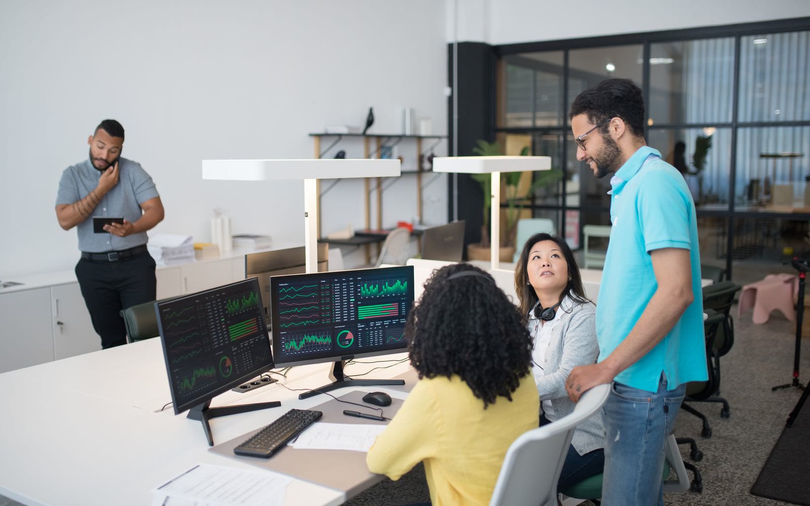 An enterprise team collaborating around a shared workspace